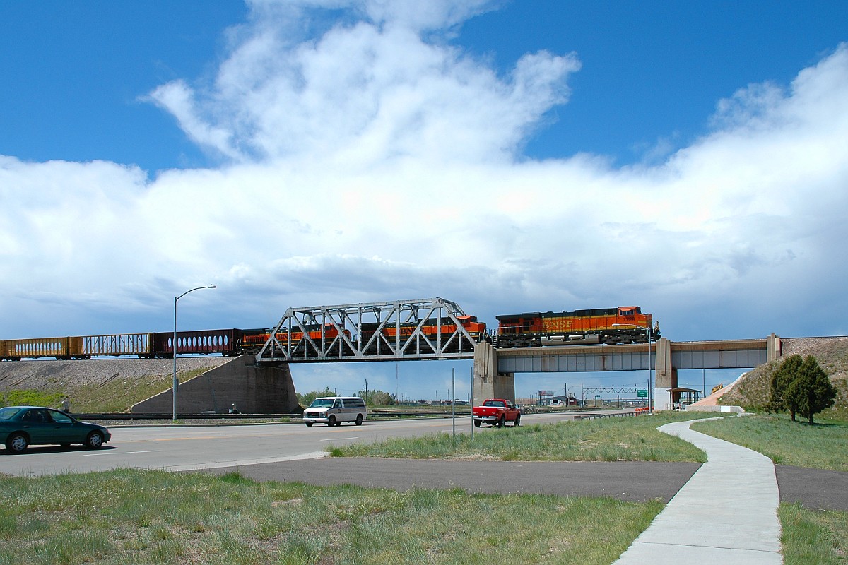 BNSF 7728 crosses the UP main line on the west side of Cheyenne, WY.